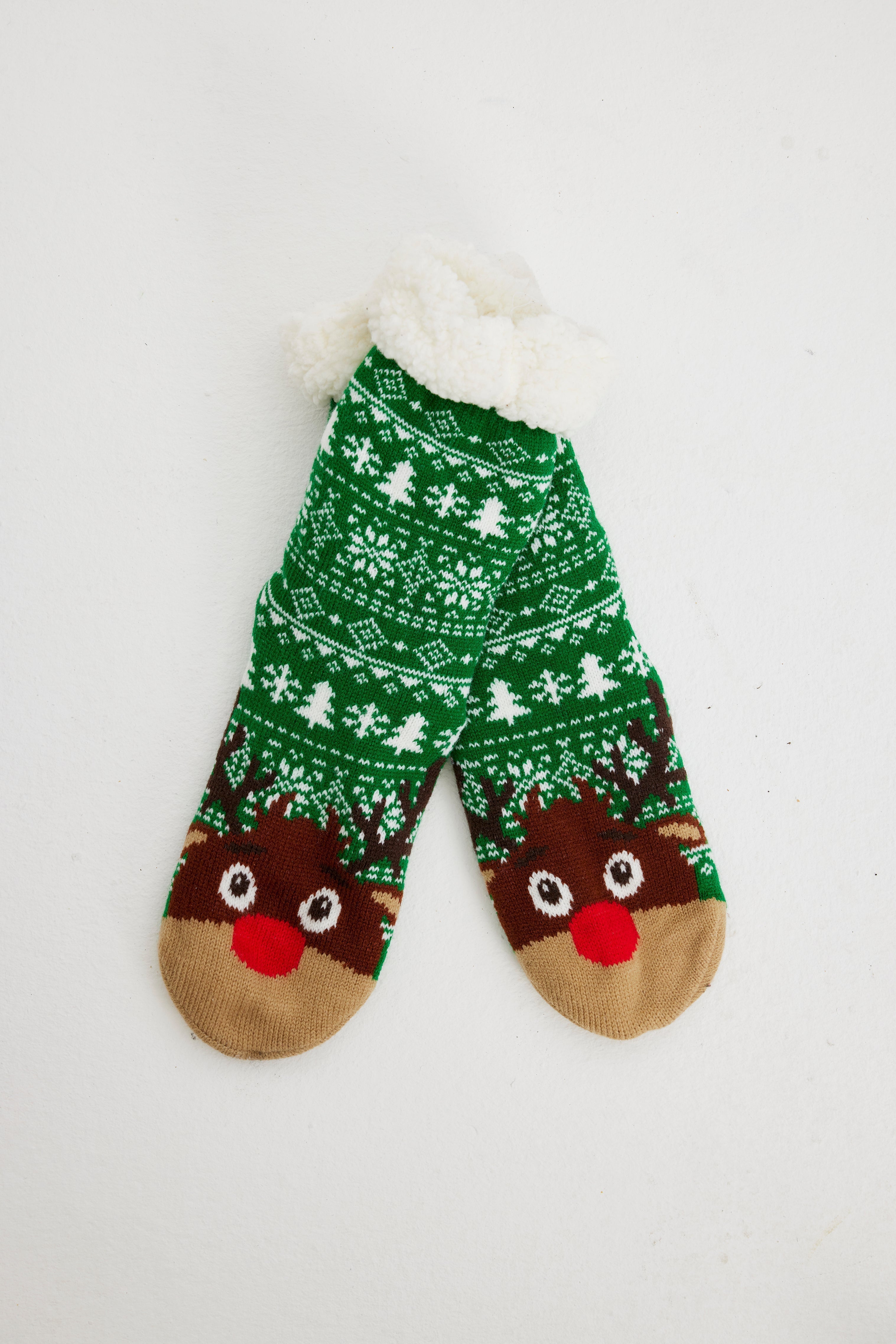 Gröna julstrumpor med renar på.